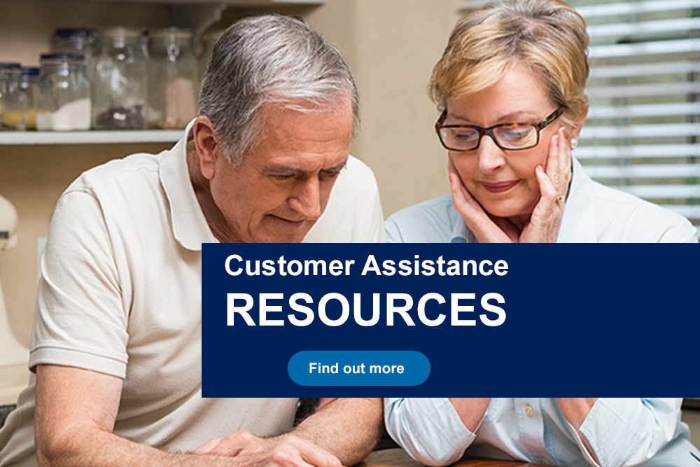 Couple checking paperwork - vulnerable customer resources banner - click here
