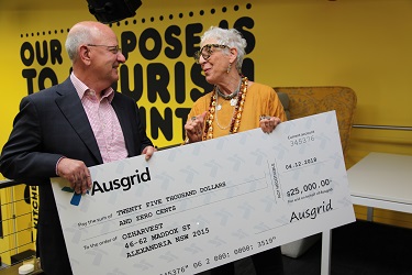 Ausgrid present cheque to OZHARVEST representative