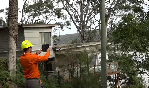 Ausgrid inspector checking private power poles for bushfire hazards