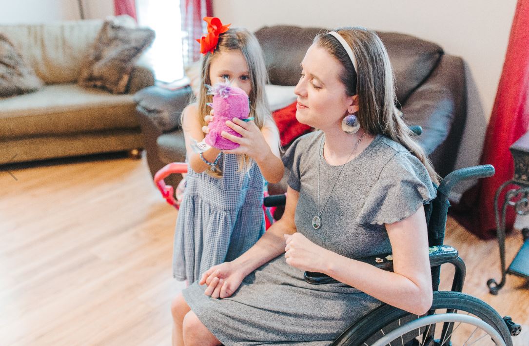A mother in a wheelchair with her daughter