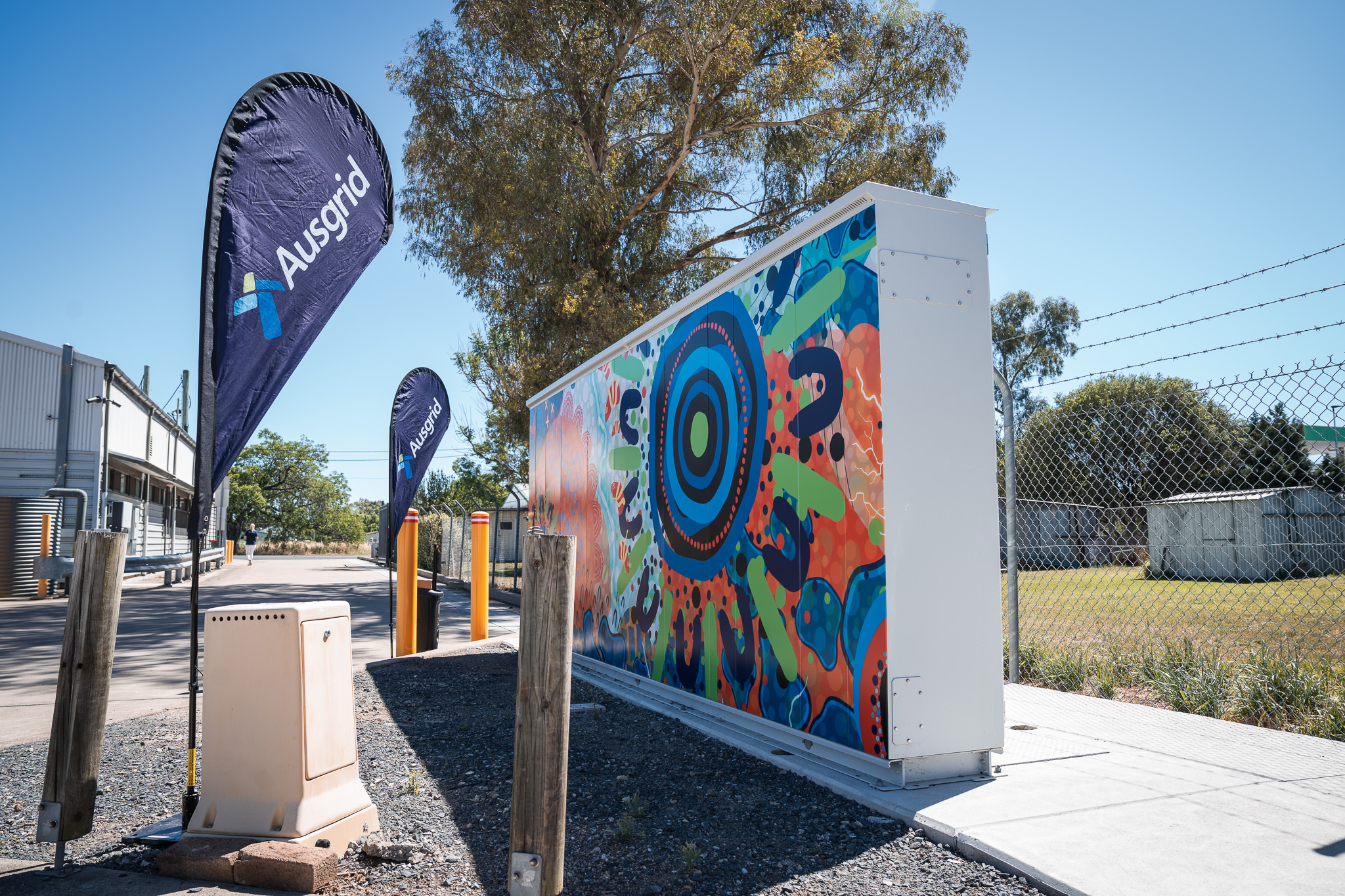 Merriwa Microgrid battery with indigenous artwork and an Ausgrid banner