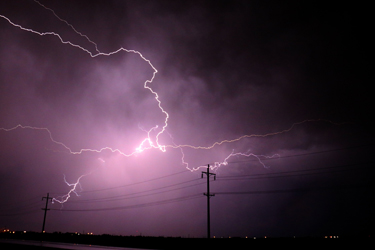 Ausgrid power poles in lightning