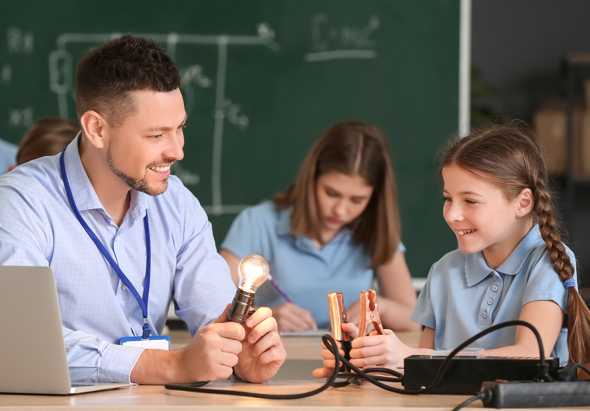 ESW teacher and student with light bulb